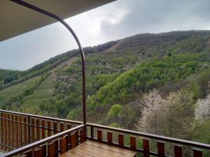 a balcony with a view of a mountain at La Casa di Cardini in San Giacomo +1 photo