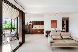 a living room with a couch and a dining room at The Central Home by Quokka 360 - Next to Lido di Lugano in Lugano