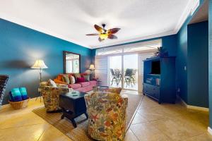 a living room with a butterfly on the ceiling at Tarpon Watch in Key West