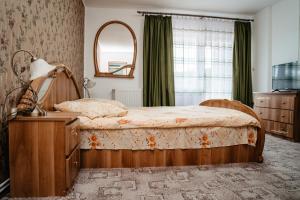 Säng eller sängar i ett rum på Complex Agroturistic Flori