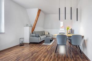 a living room with a table and a couch at Haus Hannover in Hannover
