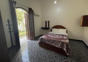 Postel nebo postele na pokoji v ubytování Gîte Hôtel Ramla Louxor