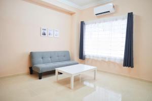 Posezení v ubytování Peach Homestay Tasik Puteri