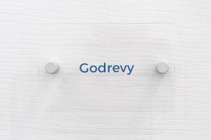 a white wall with the word godley written on it at The Nook - Self Serviced Accommodation in St Ives