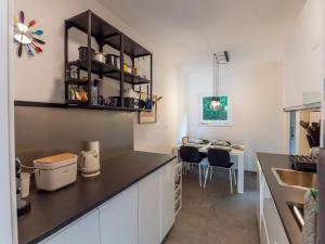 a kitchen with a counter top and a table at NIKA´S Apartment in Palit