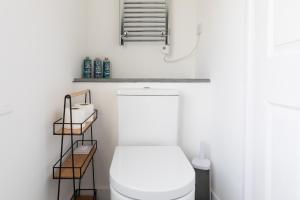 a bathroom with a white toilet in a room at The Nook - Self Serviced Accommodation in St Ives
