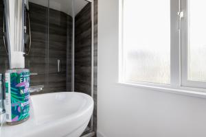 a bathroom with a white toilet and a sink at The Nook - Self Serviced Accommodation in St Ives