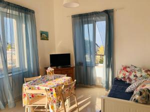 a living room with a table and a couch at La Casa di Conny in Ponza