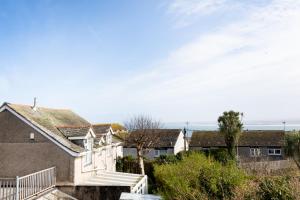 a house with a staircase leading up to it at The Nook - Self Serviced Accommodation in St Ives