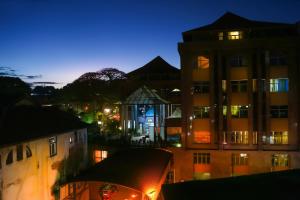 a view of a large building at night at Kandy Tower Inn in Kandy