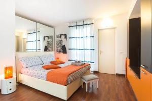 a bedroom with a bed and a mirror at Flat in Duomo in Milan