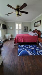 a bedroom with a bed and a ceiling fan at Fairfax Bed and Breakfast in Franklin