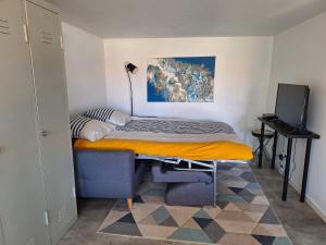 Ένα ή περισσότερα κρεβάτια σε δωμάτιο στο L'atelier, chalet proche lac et océan à Hourtin