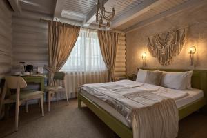 Posteľ alebo postele v izbe v ubytovaní Hotel Vedmezhyi Dvir