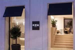 a front door of a kpk store with a sign on it at Hotel Kivir in Seville