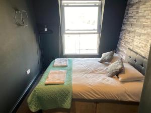 Postel nebo postele na pokoji v ubytování Amsterdam Hotel