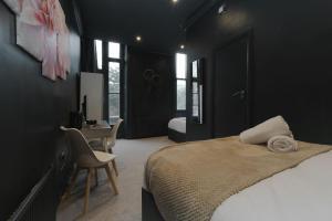 Postel nebo postele na pokoji v ubytování Amsterdam Hotel