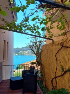 a balcony with chairs and a view of the water at Casa Vacanze Ibiscus in Portovenere