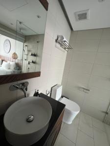 a bathroom with a sink and a toilet at Apec Mandala Phú Yên sea view in Tuy Hoa