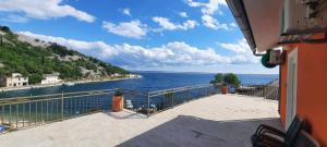 a view of the ocean from a balcony at Apartments & Rooms Jure in Viniština