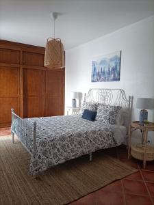 A bed or beds in a room at Casa Alentejo Litoral