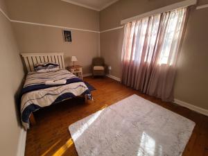 Ένα ή περισσότερα κρεβάτια σε δωμάτιο στο Cosy Guesthouse In Cookhouse - Near Somerset East