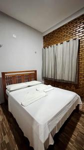 Un ou plusieurs lits dans un hébergement de l'établissement Suítes Green Village Flecheiras