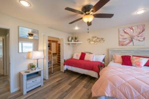 a bedroom with two beds and a ceiling fan at Fully loaded, 12 beds, cool bunk room, hot tub! in Heber City