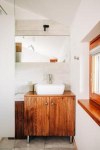 a bathroom with a sink and a mirror at Apartment House Blazar in Tolmin +61 photos