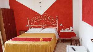 a bedroom with a large bed with a crown on it at vecchio west in Agerola