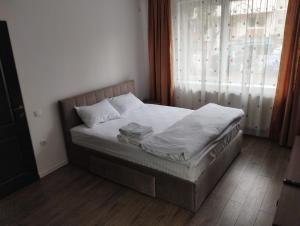 Ένα ή περισσότερα κρεβάτια σε δωμάτιο στο Apartament cu 1 camera ultracentral
