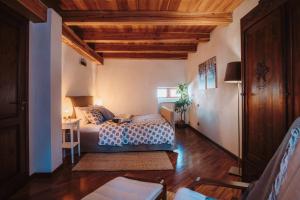 A bed or beds in a room at Case vacanze in graziosa borgata alpina