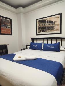 Voodi või voodid majutusasutuse Hotel Manoa toas