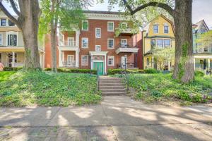 a large brick house with a staircase in front of it at Central West End Condo Less Than 1 Mi to Forest Park! in Tower Grove