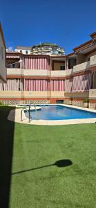 The swimming pool at or close to APTO TANEZ TORREMOLINOS, a