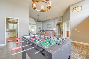 a living room with a ping pong table at Upscale Tempe Home with Heated Saltwater Pool and BBQ in Tempe
