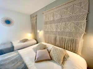 Postel nebo postele na pokoji v ubytování Hotel Les Grenadines