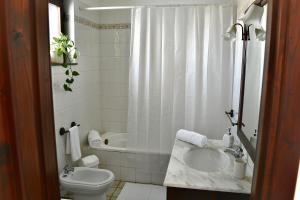a bathroom with a sink and a toilet and a shower at Casa Le Radici-Castro in Castro di Lecce +23 photos
