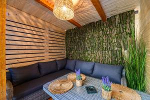 a living room with a couch and a table at AYASI Luxury Apartment Predeal in Predeal +75 photos