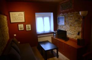 TV a/nebo společenská místnost v ubytování La Casina de Luarca