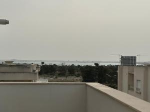 a view of a city from the roof of a building at Luxury apartment s2 in Sidi Daoud