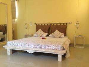 En eller flere senger på et rom på Mwembe Resort - The Village