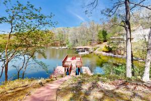 a small house on the side of a lake at 1 Special Place in Moneta