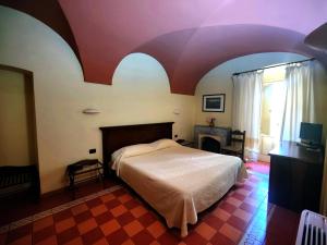 Voodi või voodid majutusasutuse Corte Fiorita Albergo Diffuso toas
