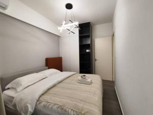 a bedroom with a large bed with a ceiling at Rita's 2-BR Apt in Mar Mikhael in Beirut