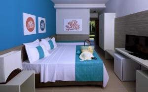 Postel nebo postele na pokoji v ubytování Tabaobí Smart Hotel