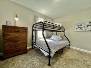 a bedroom with a bunk bed and a dresser at 7086 Tylersville Beautiful 4 BDR Home - Near I-75 in Maud