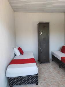 Cama o camas de una habitación en Hostel Sossego