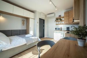 Kuchyň nebo kuchyňský kout v ubytování WiguryTower Apartaments 96