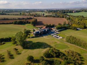 an aerial view of a large house on a green field at Cave Hotel near Canterbury in Faversham